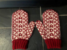 Load image into Gallery viewer, A pair of red and cream knit winter mittens with "Canada"
